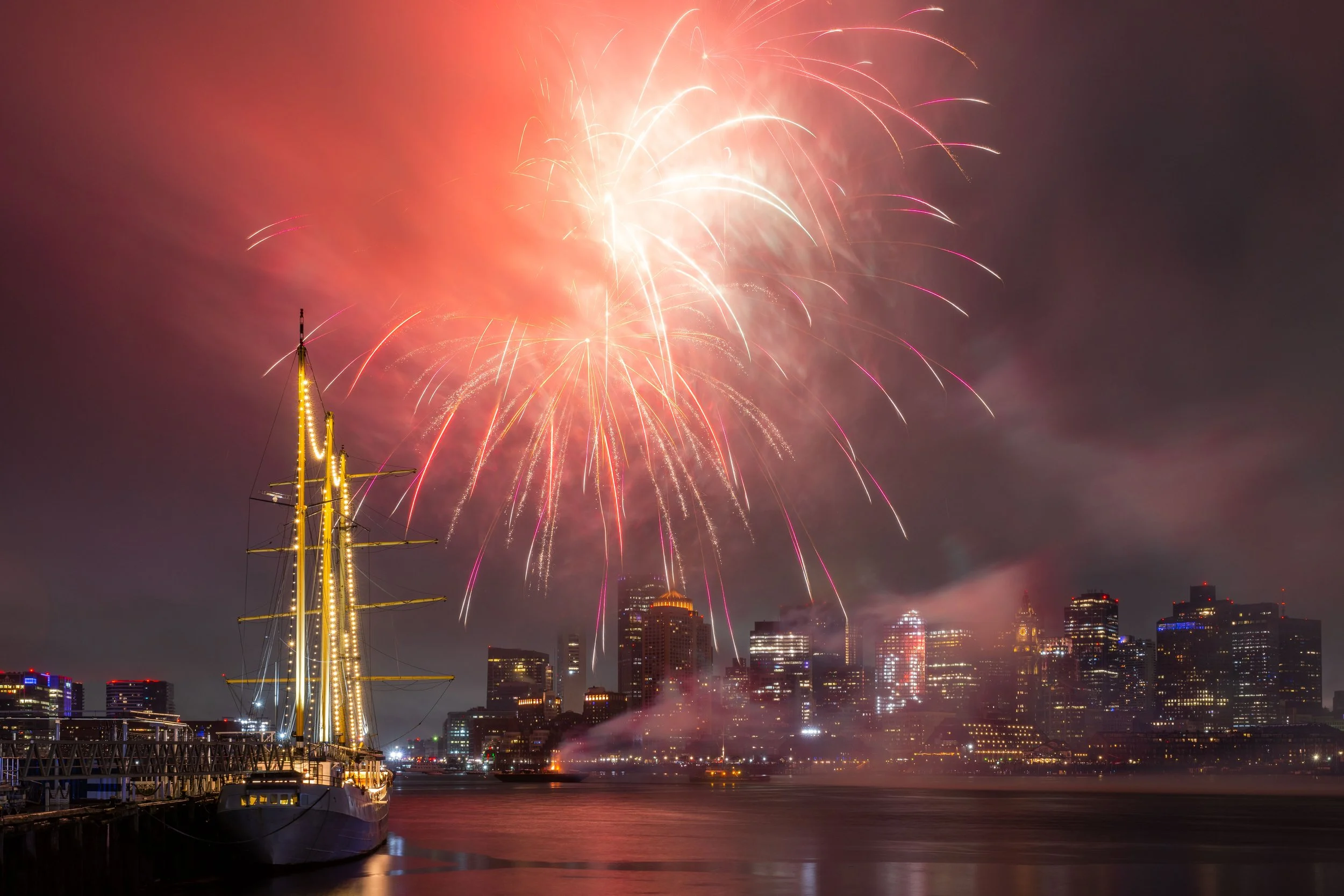 Fireworks light up the sky over Boston Harbor during New Year's Eve celebrations