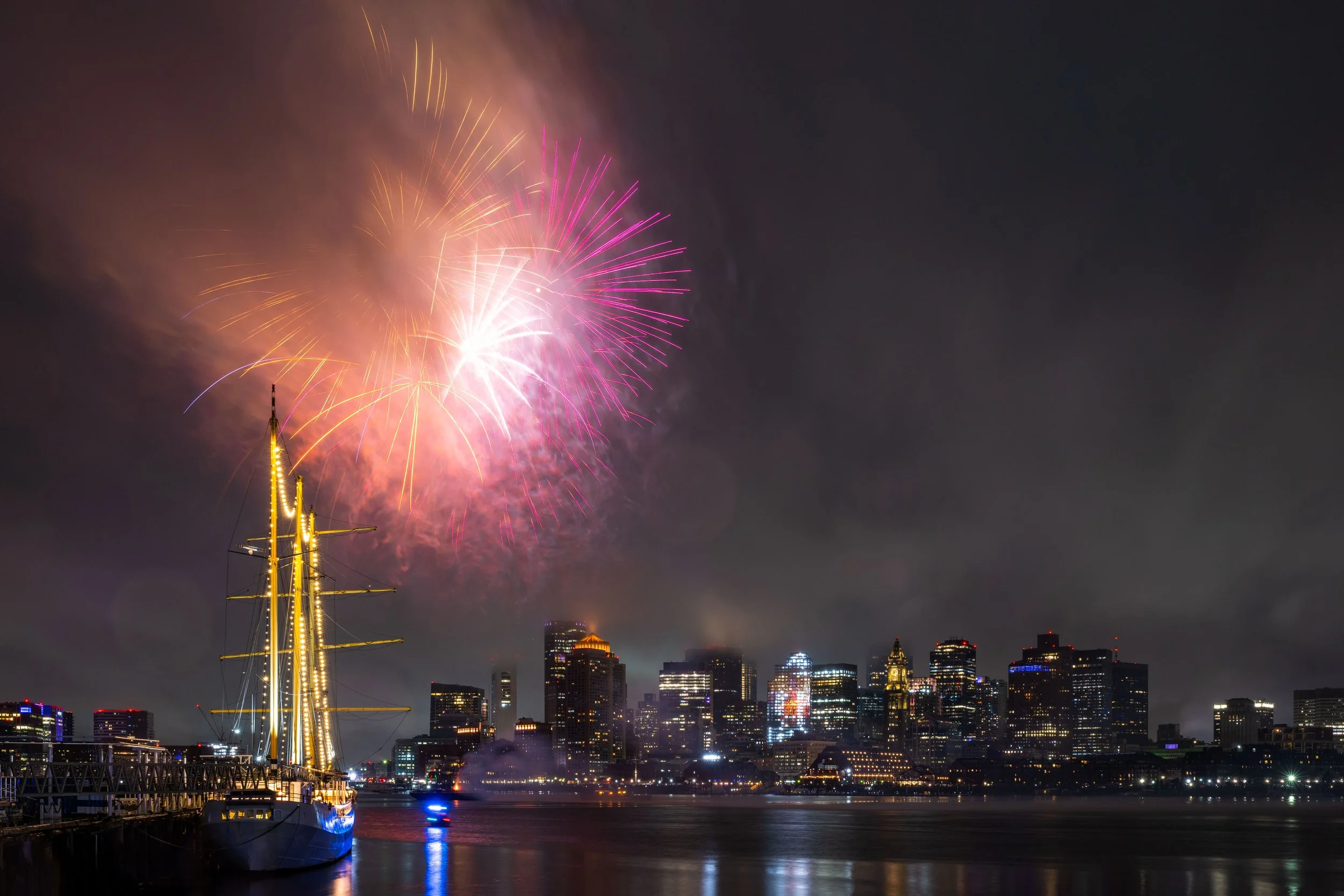 Fireworks light up the sky over Boston Harbor during New Year's Eve celebrations