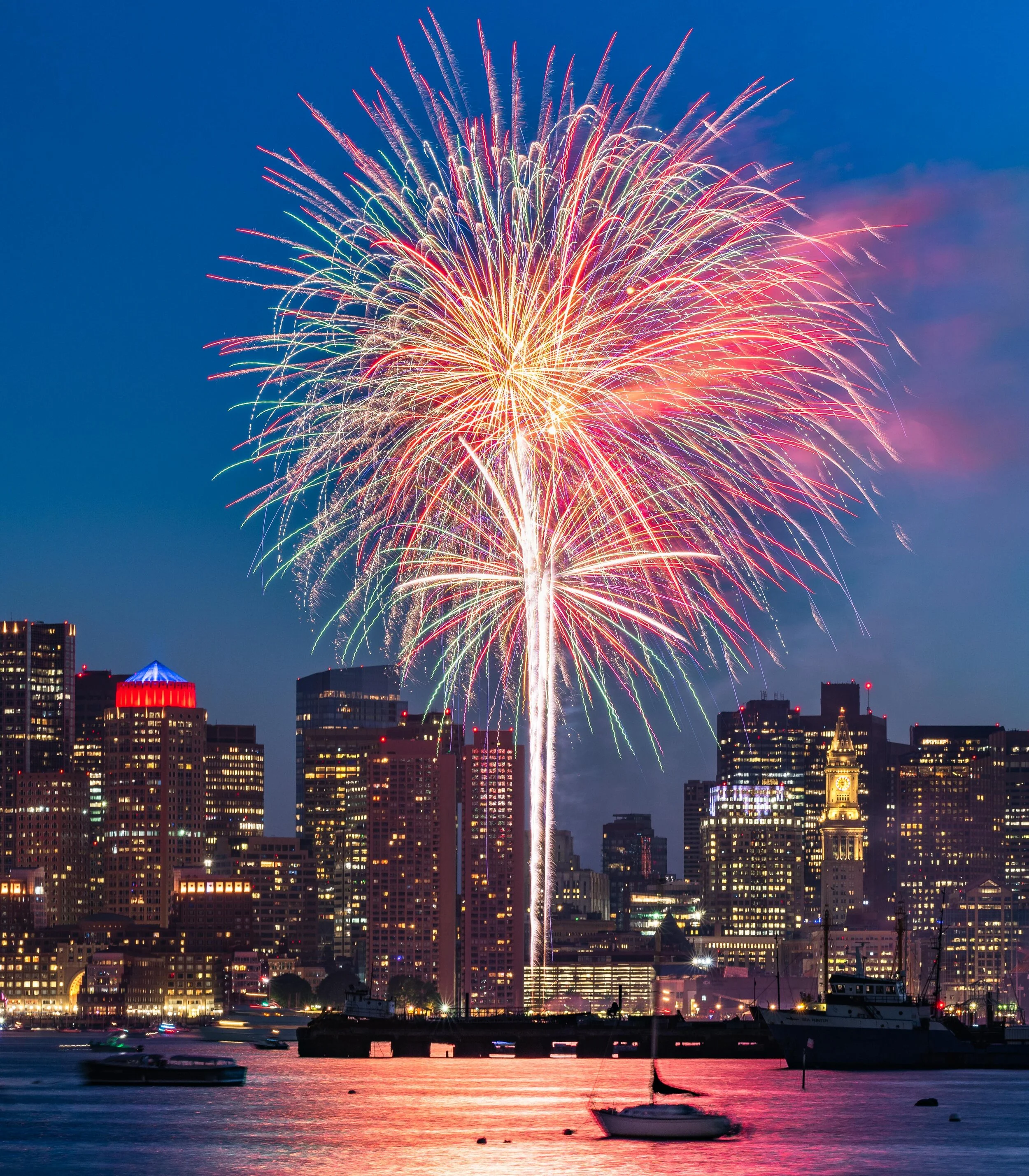 Fireworks seen over the Boston Skyline, taken from the Hyatt Harborside at Logan Airport.