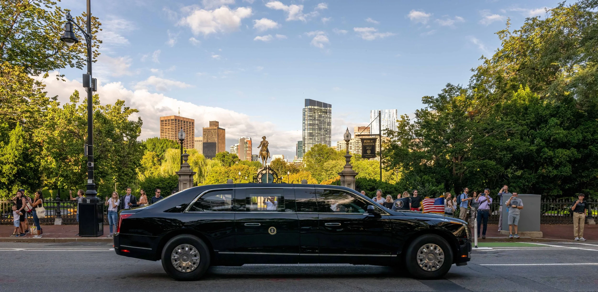 The "Beast" carrying President Biden drive past Boston Public Garden